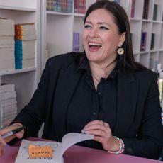 Author Callie Hart signs a book and smiles while attending the Los Angeles Times Festival of Books used for a story explaining everything we know about the quicksilver movie adaptation